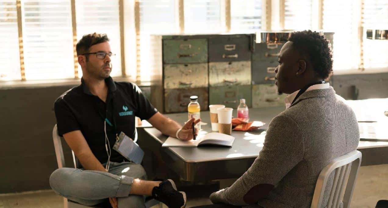 This is a picture of an interview between two people in a trendy office for an article called how to use Market Intelligence in recruitment by Octopus Market Intelligence, Market Analysis & Competitor Analysis. How to Manage an Office Upgrade