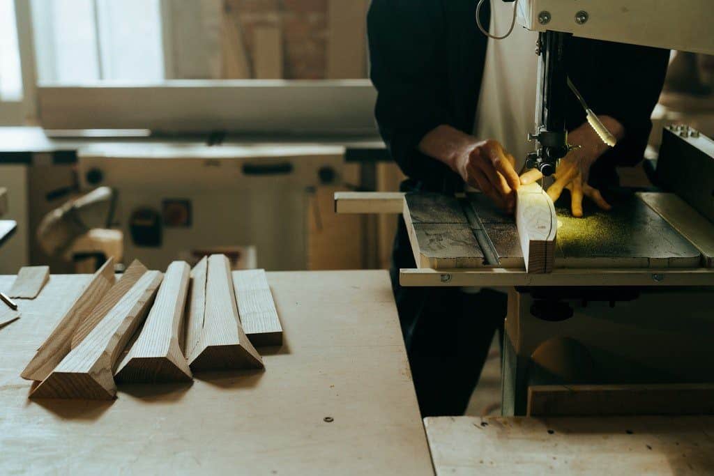 The is a picture of a Man in workshop designing a wooden product for an article titled How to do a market analysis for a business plan By Octopus Intelligence. Solving problems with Competitive Intelligence, common sense and market analysis. The Three Essential Components of Product Market Analysis. What should be included in a competitor analysis? The Essential Components of a Competitor Analysis
