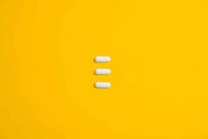 This is a picture of 3 white tablets within a yellow back ground for an article entitled 3-things-you-can-do by Octopus Intelligence. Solving problems with Competitive Intelligence, common sense and market analysis