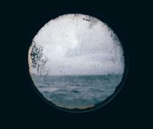 This is a picture of a A porthole on a rough seas for an article titled Competitor Intelligence research & Market Intelligence By Octopus Intelligence. Solving problems with Competitive Intelligence, common sense and market analysis