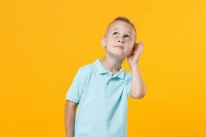 This is a picture of a fun male fair-haired boy 5-6 years old wearing stylish blue turquoise t-shirt polo try to hear you overhear listening intently isolated on yellow color wall background for a page entitled competitive intelligence topics help by Octopus Competitive Intelligence beat competitors, increase sales, solve problems, Competitor Analysis Counter intelligence helps ships safely navigate angry waters What is counter intelligence? What is hypothesis testing within competitive intelligence? Strategies for Marketing, Testing, and Expanding Your Company