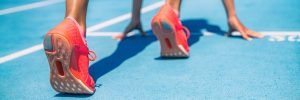 This is a picture of a Sprinter waiting for start of race on running tracks at outdoor stadium for an article called how to do Competitor Analysis in 2021 by Octopus Competitive Intelligence providers of Market Intelligence. How accurate is fast people search?