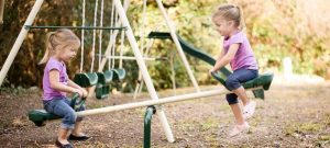 This a picture of a two girls on a seesaw for an article called What makes an excellent Competitive Intelligence and OSINT Analyst by Octopus Competitive Intelligence consultancy for Competitor Analysis and market intelligence services