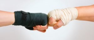 This is a picture of fists representing strengths for an article called How to do SWOT Analysis with Competitive Intelligence Questions by Octopus Competitive Intelligence Competitor Analysis focused on creating certainty. SWOT analysis is a popular tool used to assess internal and external environments.