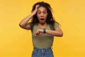 This is an image of a amazed and shocked female keeps her hand on head starring into camera with stressed facial expression she missed her bus for an article called Competitive Intelligence Research and urgent last-minute enquiries by Octopus Competitive Intelligence Competitor Analysis focused on creating certainty