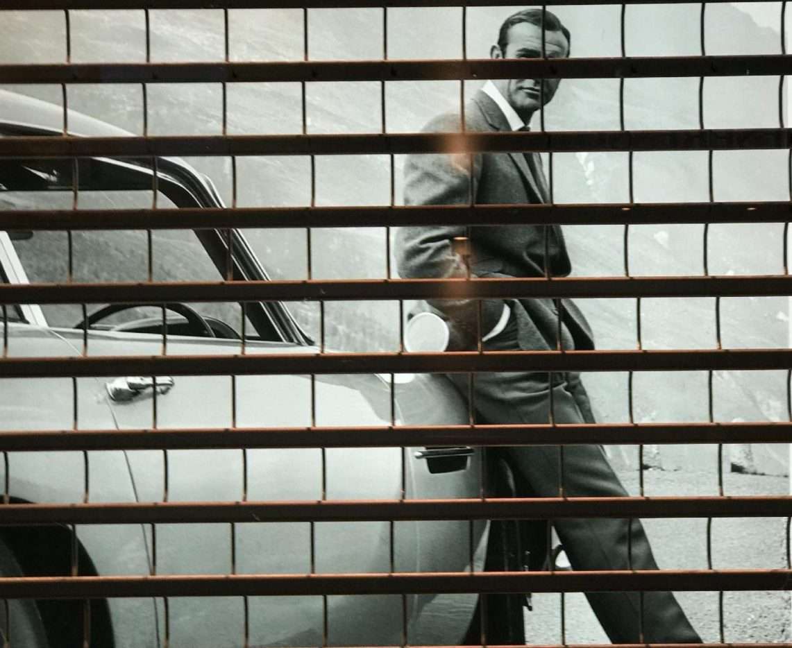This is an image of james bond next to his Aston Martin for an article called Which one of your Competitors is Going to Kill You Off by Octopus Competitive Intelligence Competitor Analysis focused on creating certainty jumpstory-download20210915-124125