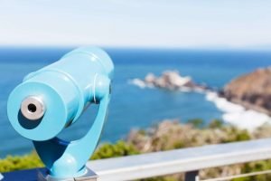 This is a picture of binoculars at the beach for an article called How to find out who your competitors are and then beat them by Octopus Competitive Intelligence Competitor Analysis