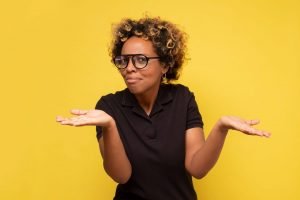 This is an image of a girl asking why with a yellow background for an article called Why is Competitive Intelligence the killer secret to your success by Octopus Competitive Intelligence consulting agency research your competitors