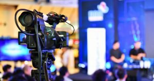 this is an image of a video camera at a press conference for a press release called Academy of Competitive Intelligence announces a partnership with Octopus Intelligence by Octopus Competitive Intelligence consulting agency research your competitors market intelligence. Top Benefits of Digital Screens in Business Communication. How to Convert VOB to MP4: Expert Tips and Tricks Revealed. Top Tips for Using Video Content to Gain a Competitive Edge in Your Market. Making Your Business Intelligence Conference Worth the Effort