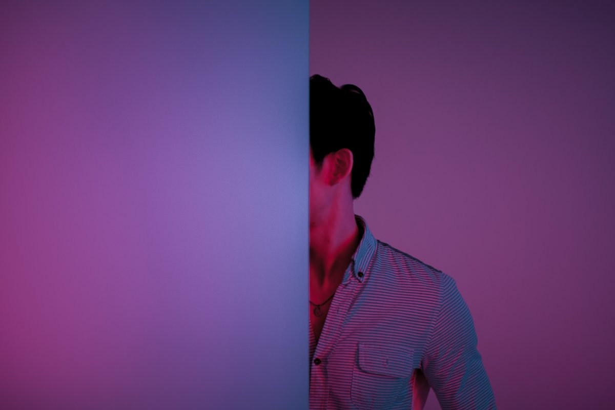 This is an image of a hidden person behind a wall like a new competitor you cant see for an article called Why Disruptive Competitors Are Dangerous and Insight Needed to Navigate Changing Landscapes by octopus competitive intelligence agency market intelligence company and competitor analysis solutions road-trip-with-raj-IaSRjVkB6tE-unsplash