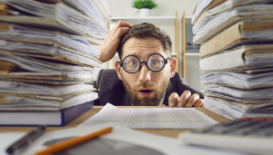 This is an image of a man overwhelmed by information introduction to finding basic competitor information by Octopus Competitive Intelligence Agency Octopus market intelligence company Octopus competitor analysis solutions. How Do I Find a List of Competitors' Customers? Steps to Enhance Your IT Skills for Professional Development. Safer Ways to Save Information