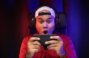 This is an image of a gamer for an article called War Gaming in Business to Navigating Your Competitive Landscapes by octopus competitive intelligence agency octopus market intelligence agency Who Are Competitors in a Business? 4 Tips for Developing a Blockchain-Based Game. The Role of Competitive Intelligence in Gaming Hardware Development. What Are the Lucrative Online Games for Professional Gamers? What are the top 5 business strategies for online gaming?
