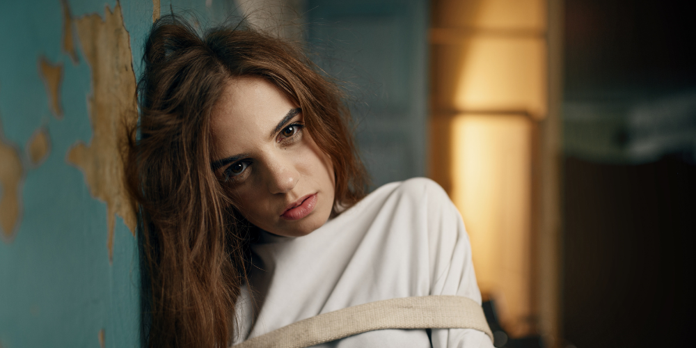 This is an image of a girl in a straight jacket for an article called Why Hiring a Competitive Intelligence Manager Isn't Enough The Unseen Intelligence Gap by octopus competitive intelligence solutions octopus market intelligence agency