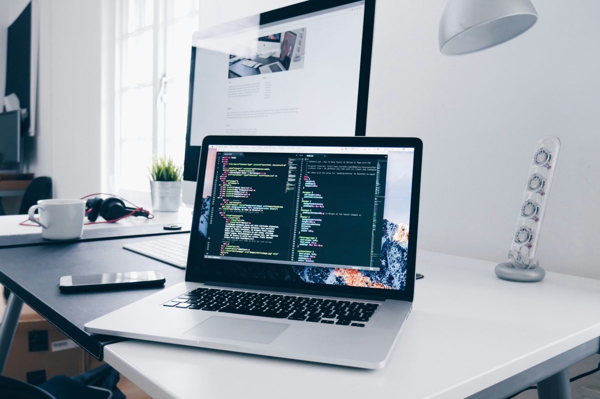 This is an image of a computer with coding for an article called AI, Automation, Competitive Intelligence, and the Future of Business by octopus competitive intelligence agency. How to Implement Zero Trust Principles in Your Business: 10 Steps. How Intelligent Automation Is Changing the Future of Hiring and Workflow Efficiency